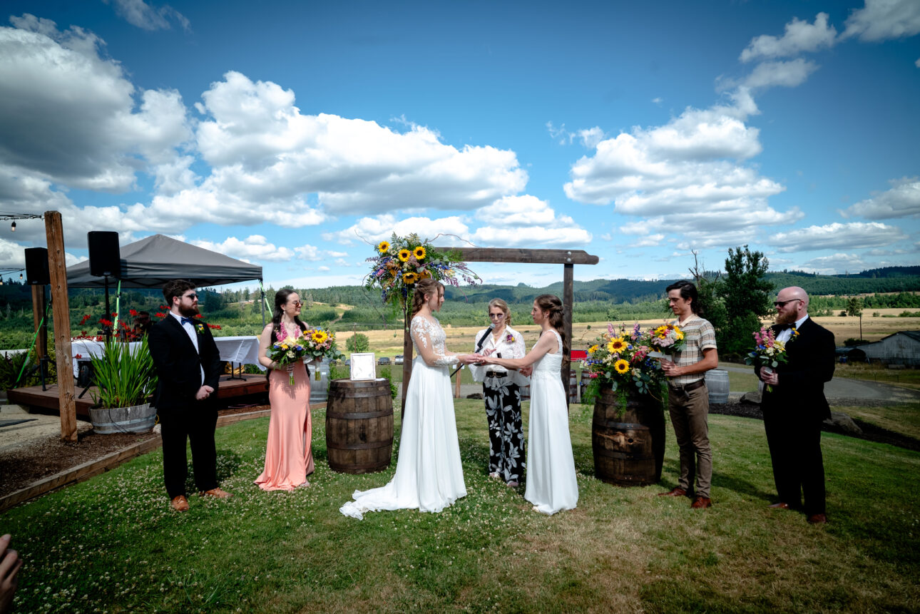 Two brides met at an alter among the mountains. At Alesong Brewing & Blending in Eugene, OR